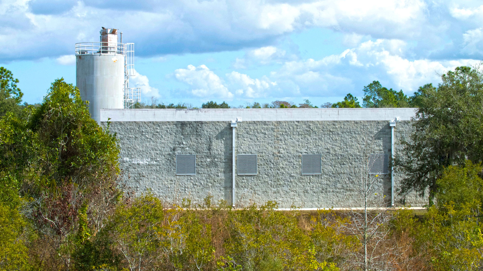 Taylor Creek Reservoir pump station building behind trees.